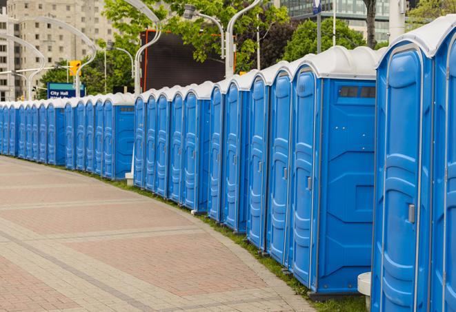 a row of sleek and modern portable restrooms at a special outdoor event in Babson Park